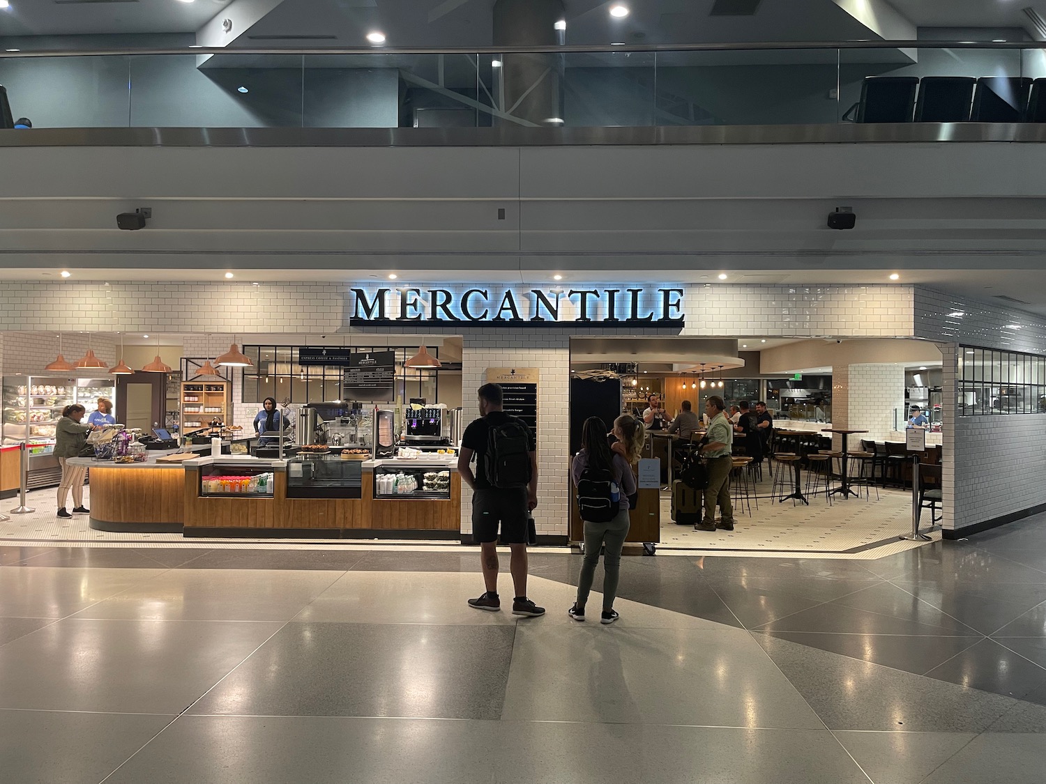 people standing in front of a store