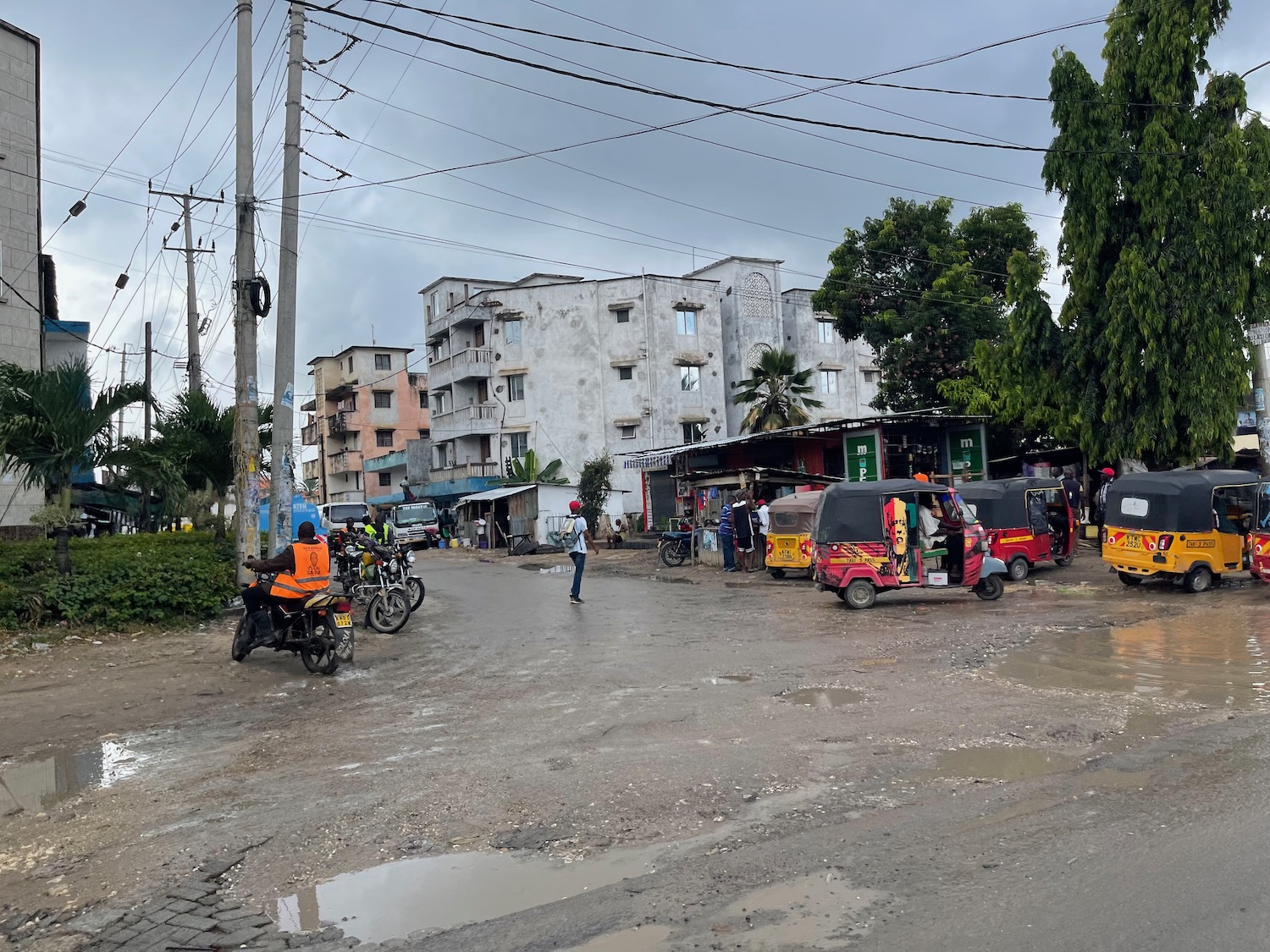 a street with cars and people on it