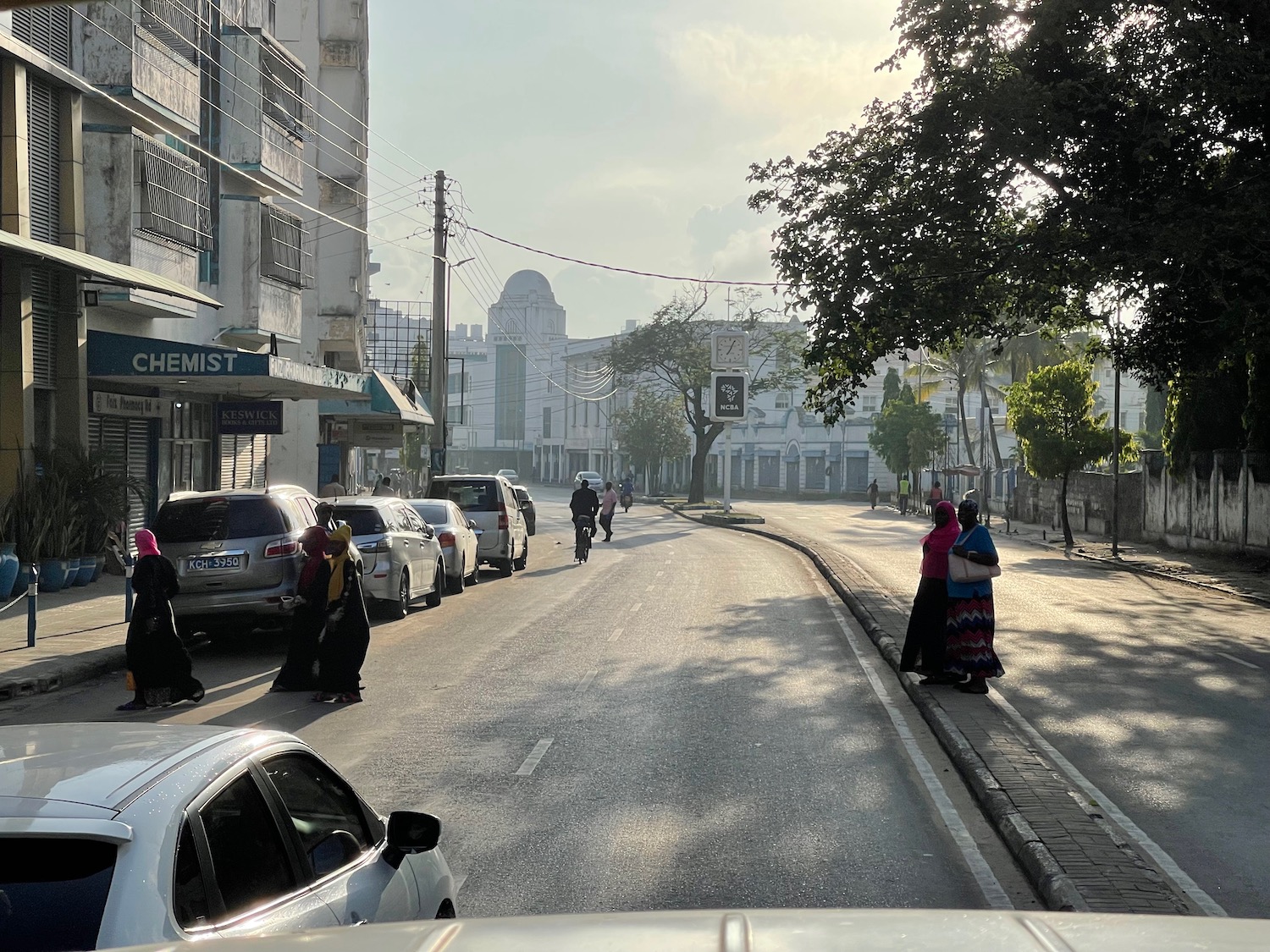 a group of people walking on a street