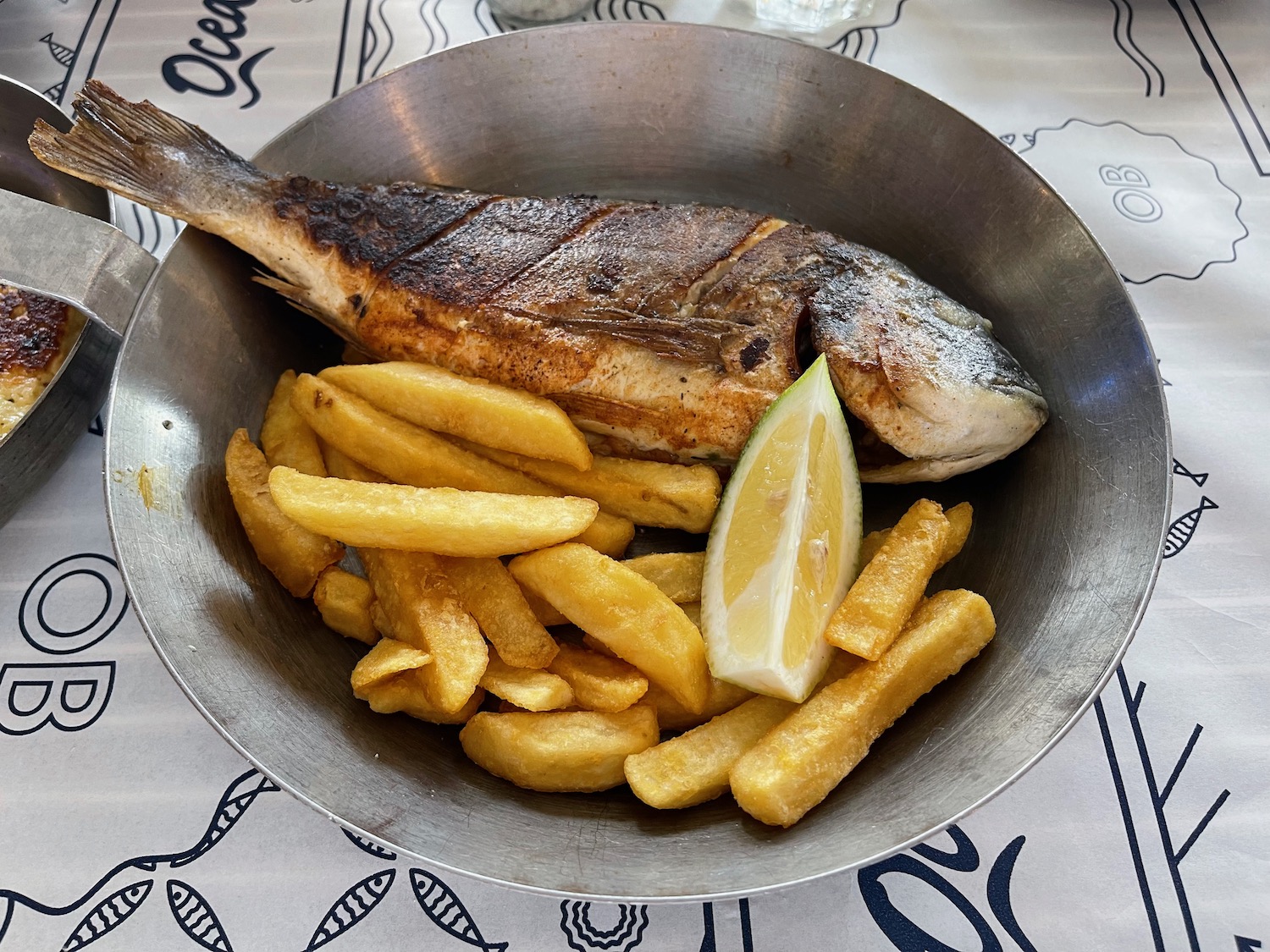 a fish and fries in a bowl