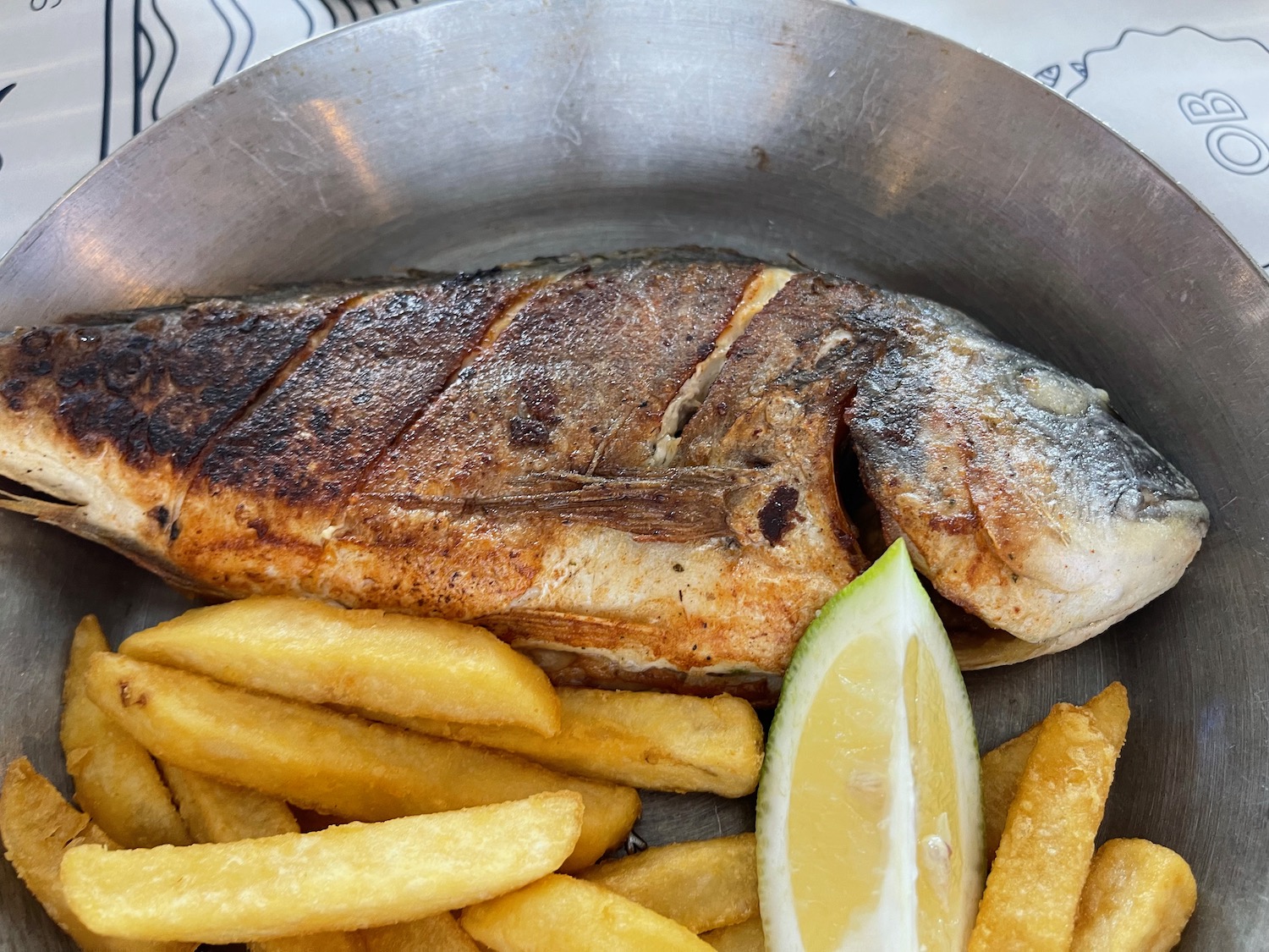 a fish and fries in a pan