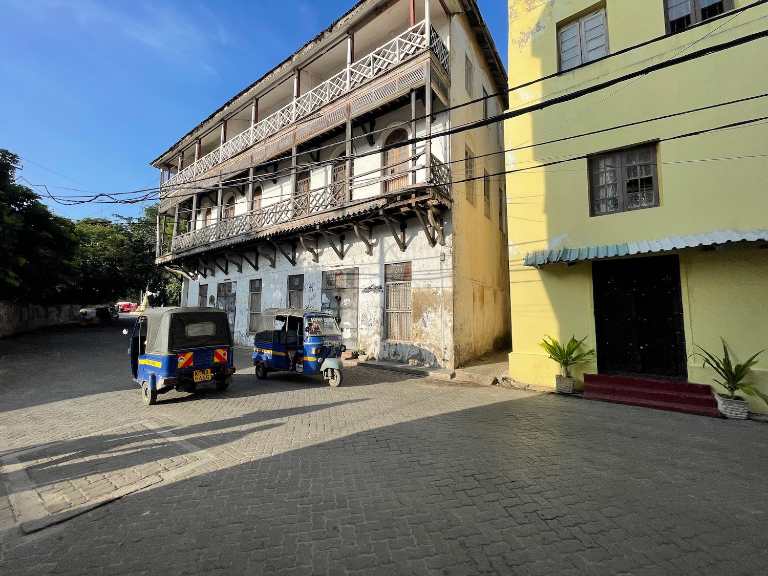 a two cars parked in front of a building