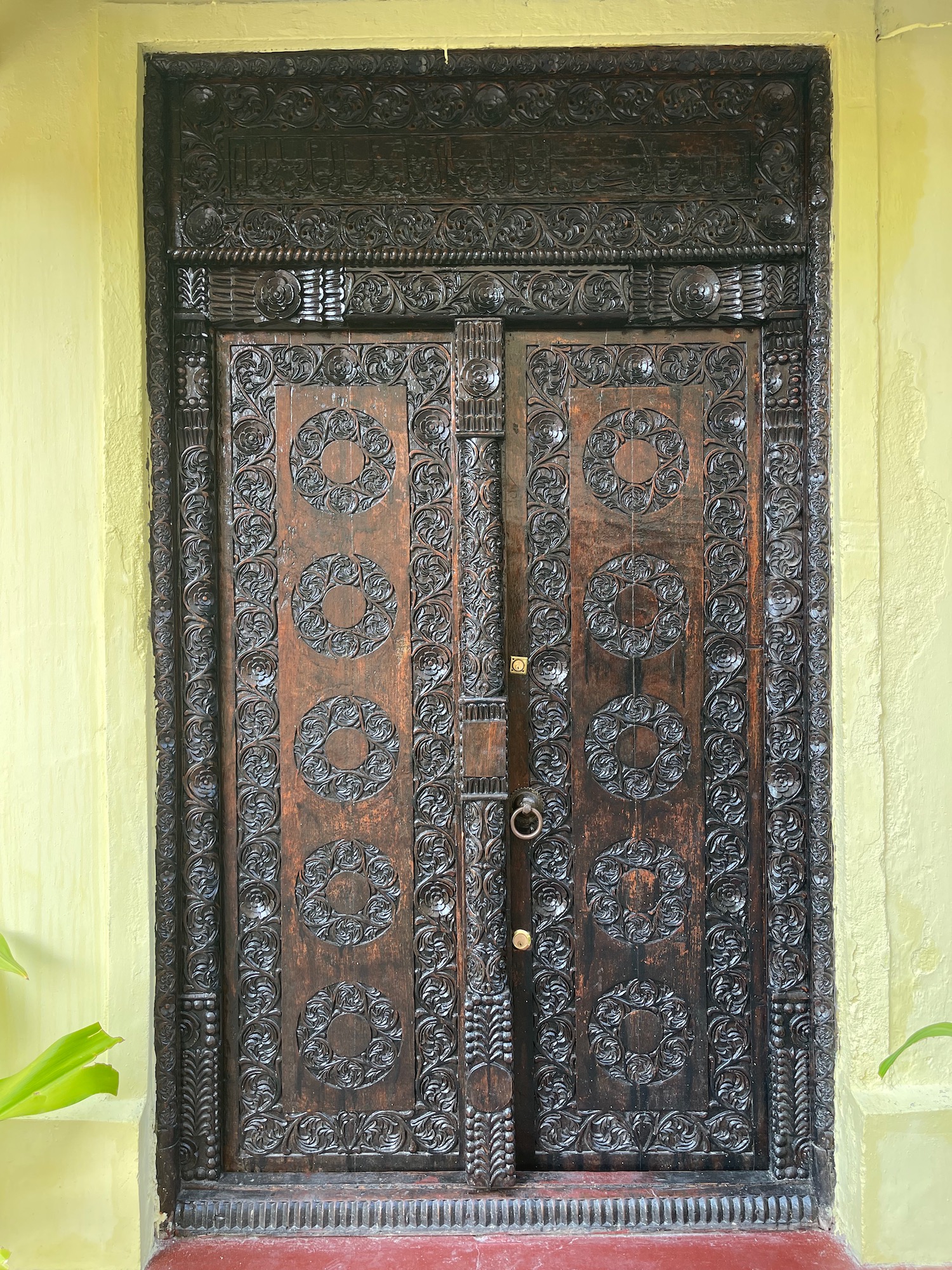 a wooden door with carved designs