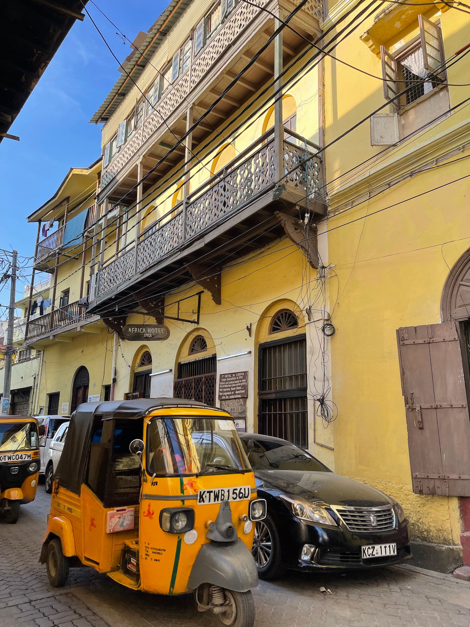 a yellow vehicle parked on a street