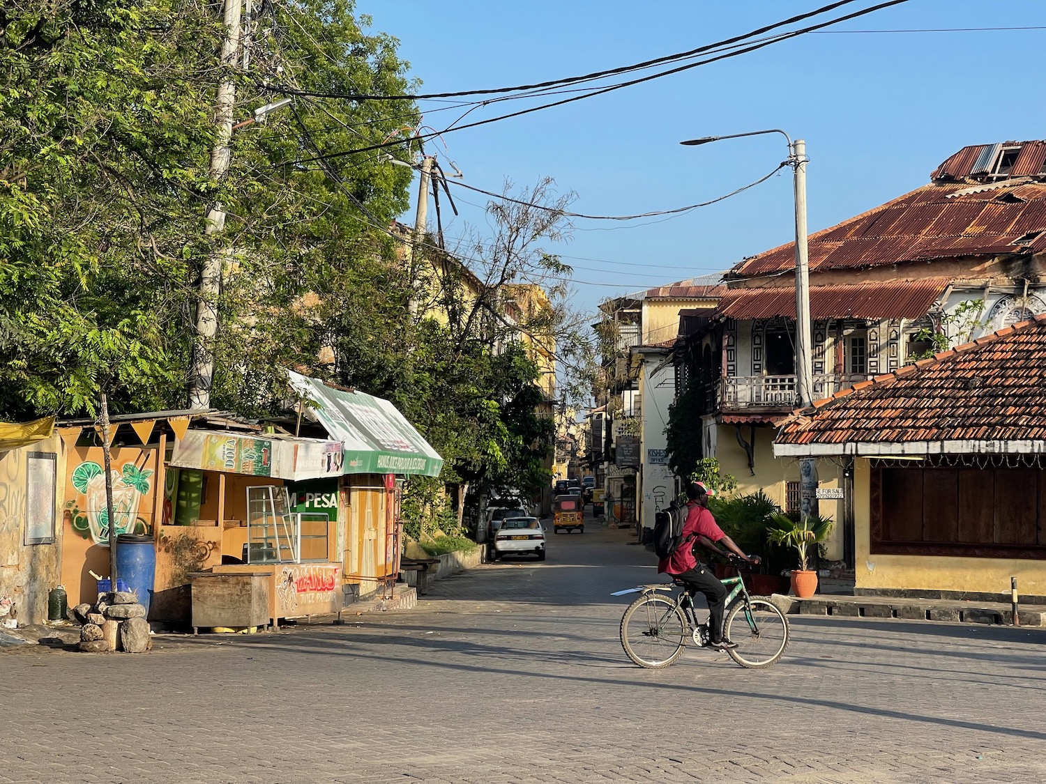 a person riding a bicycle on a street