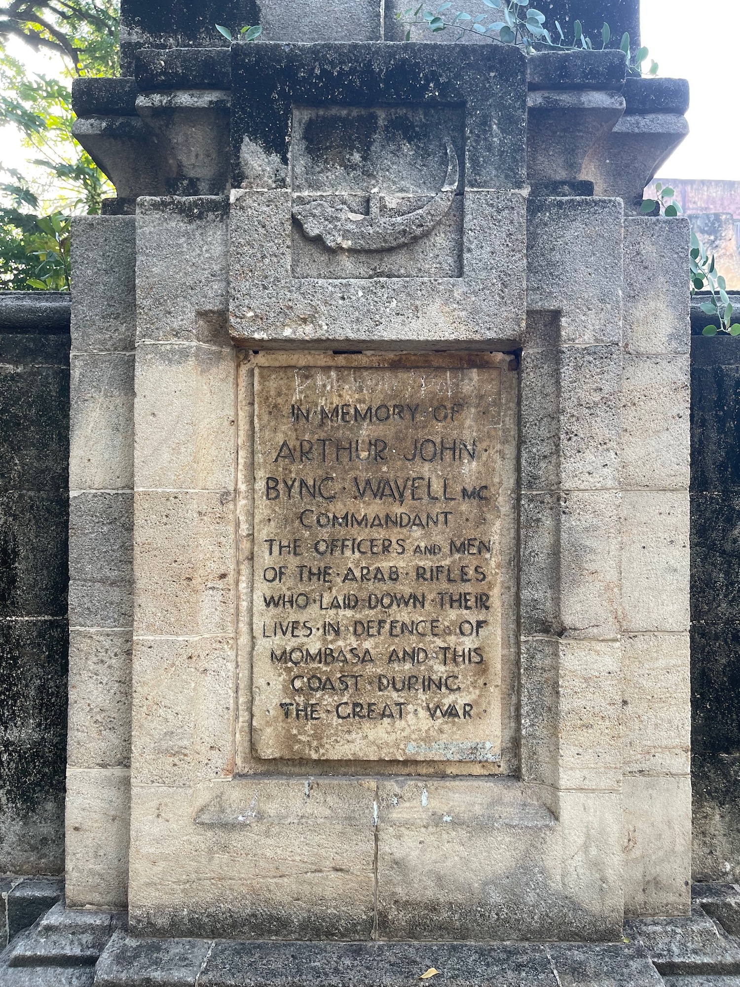 a stone plaque with writing on it