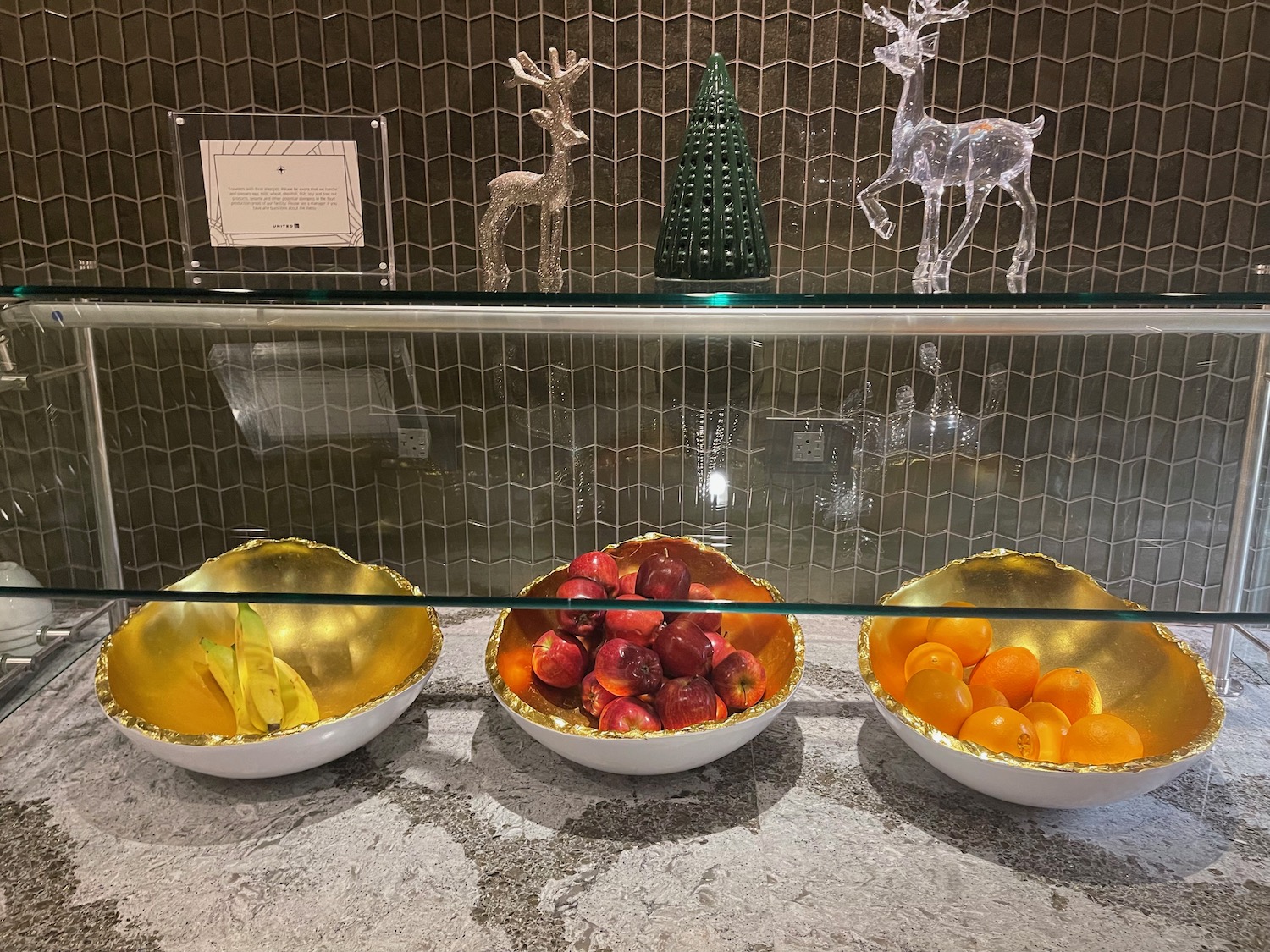 bowls of fruit in a glass case