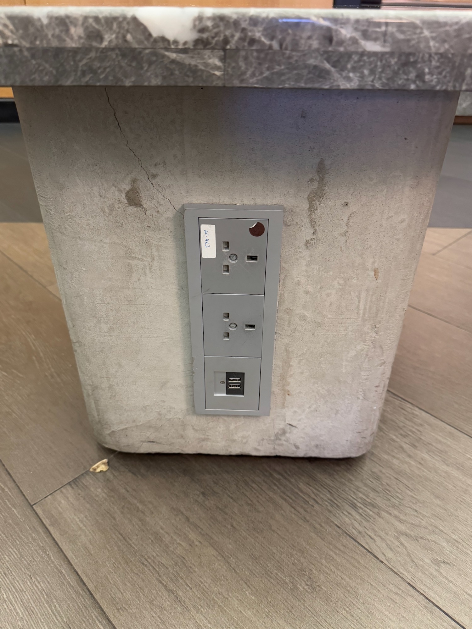 a rectangular object with a rectangular outlet on it
