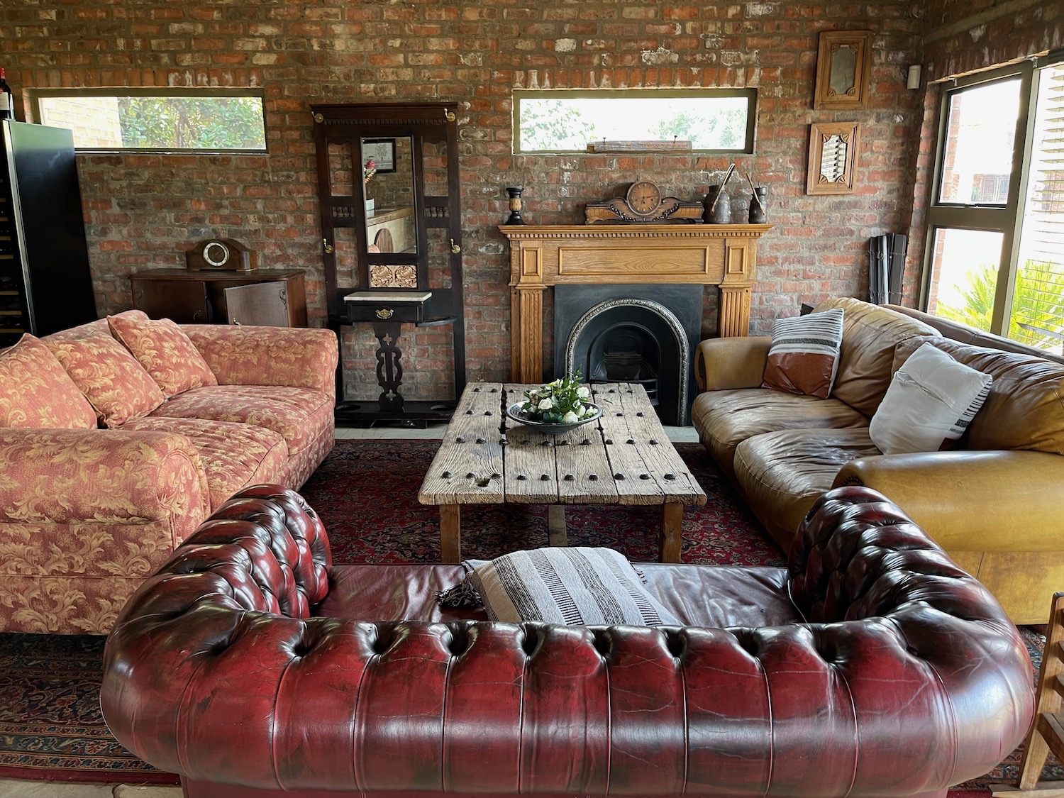 a living room with a fireplace and couches