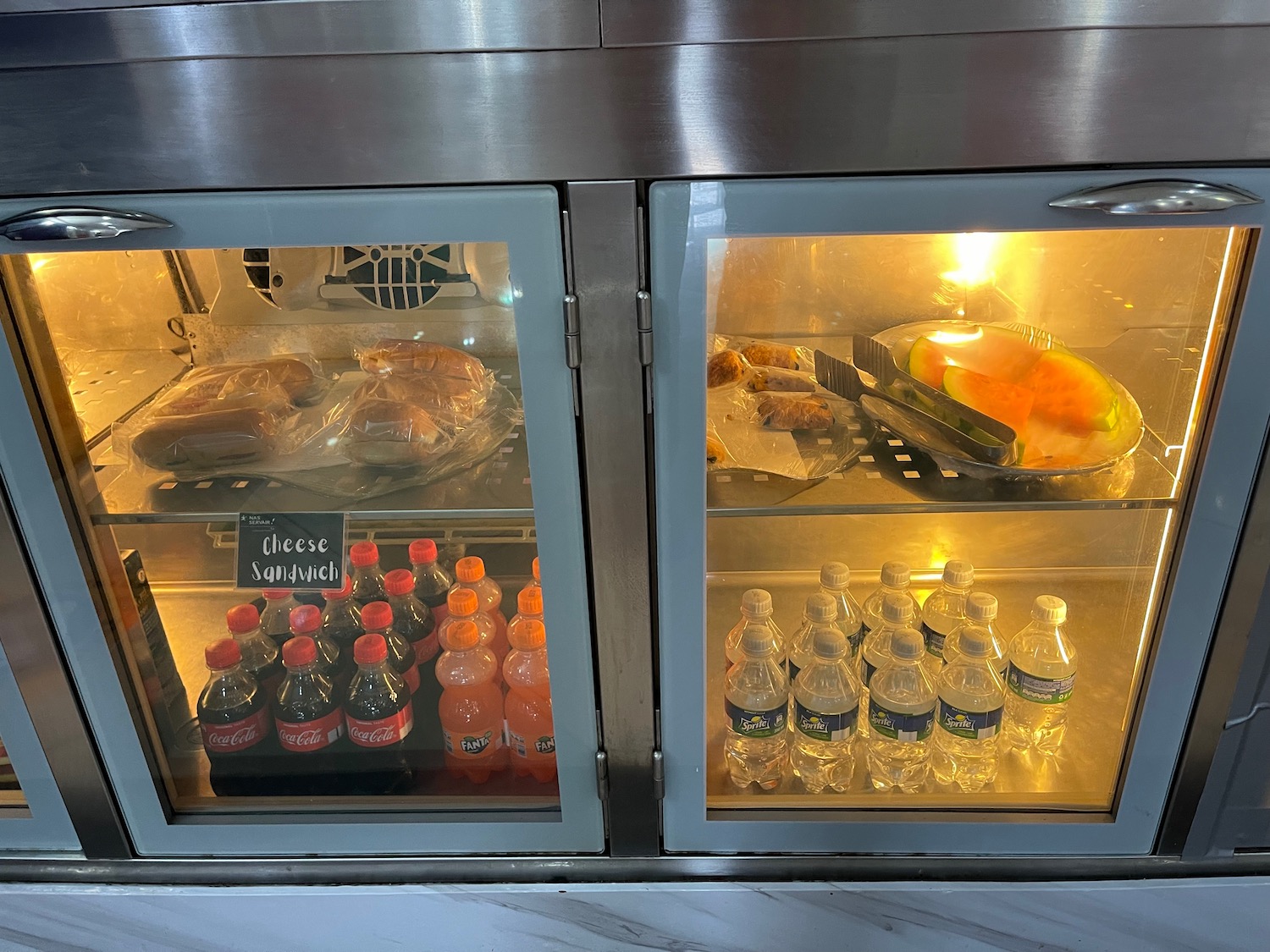 a refrigerator with food and drinks in it