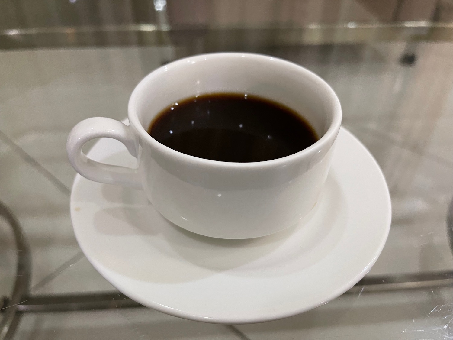 a cup of coffee on a saucer