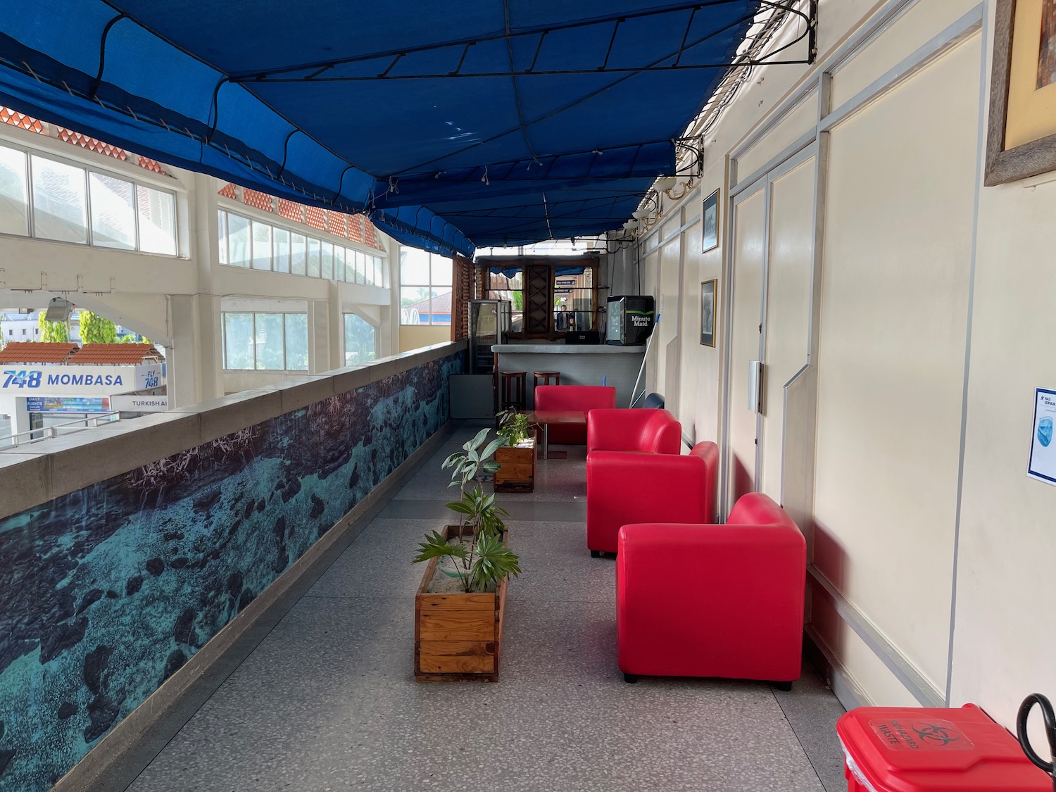 a red chairs and a blue canopy