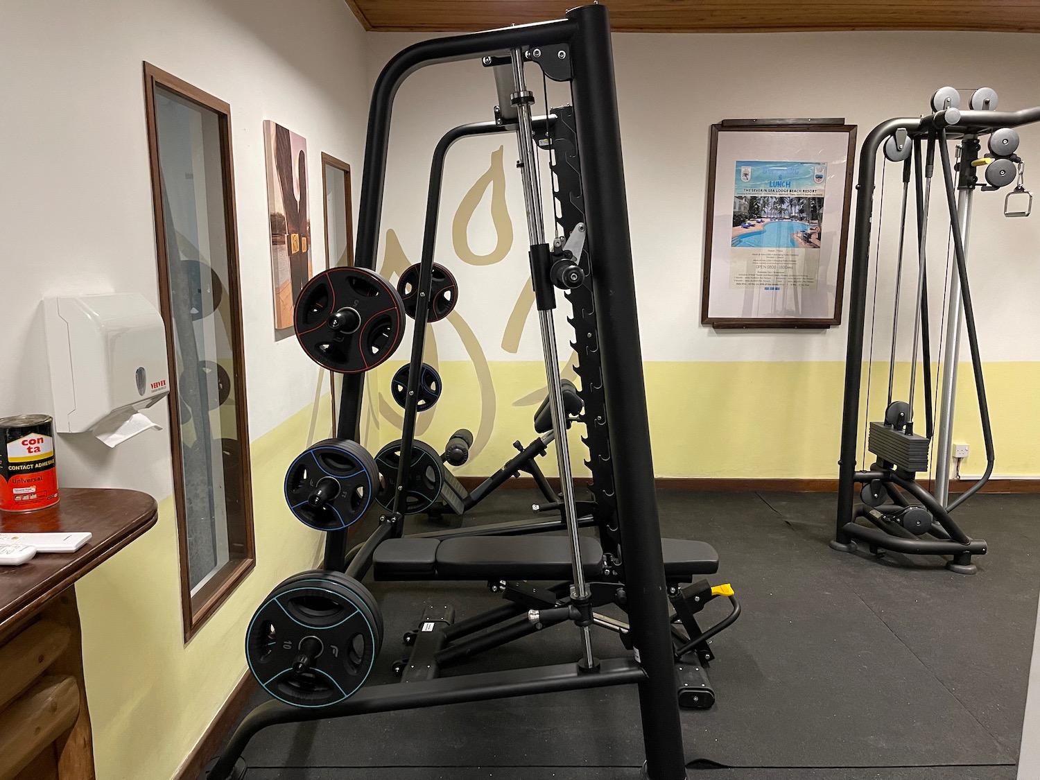 a gym with weights in the corner