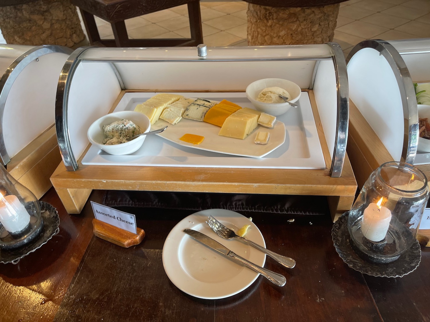 a plate of cheese and butter on a table