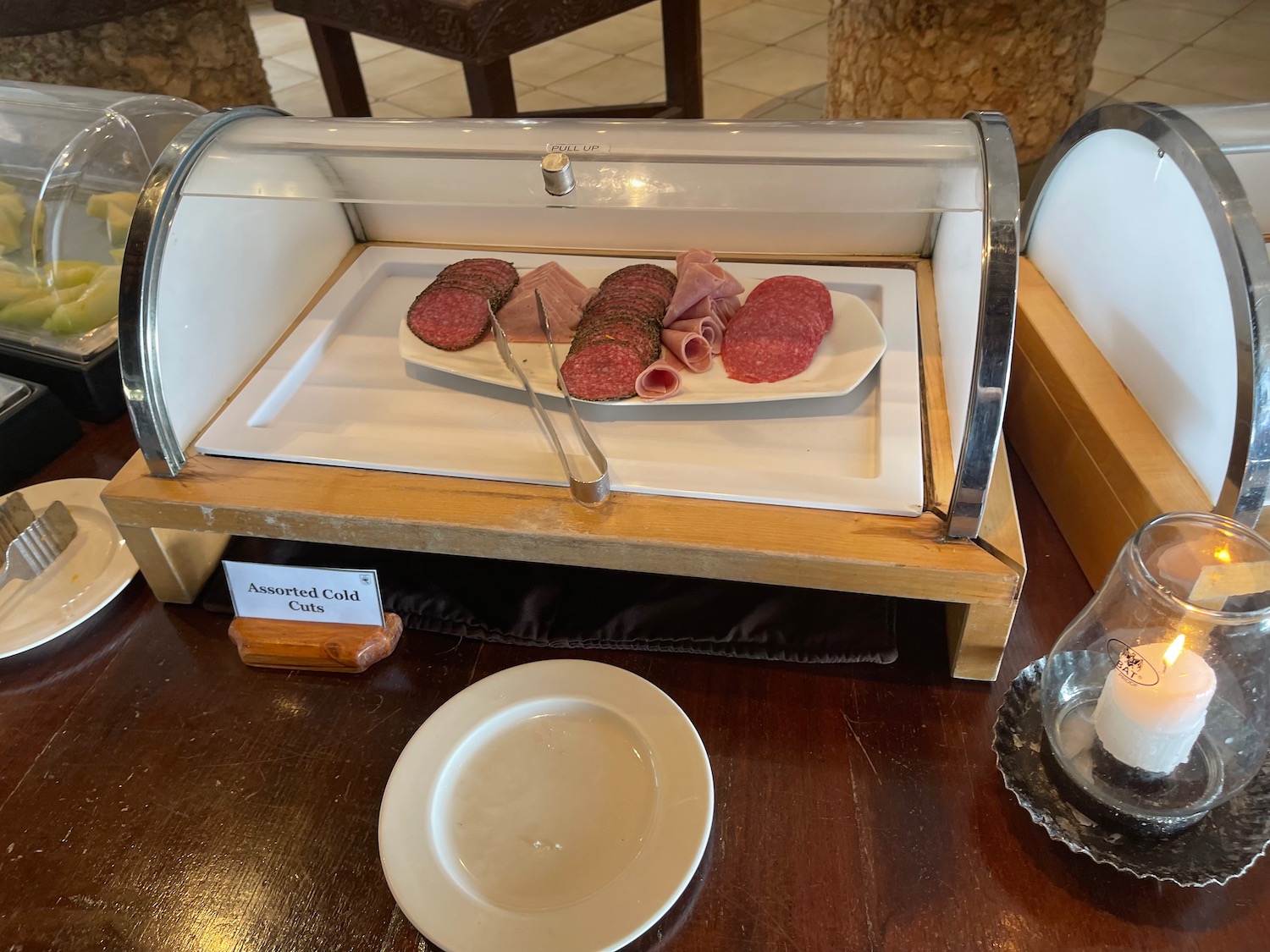 a tray of meat and sausages on a table