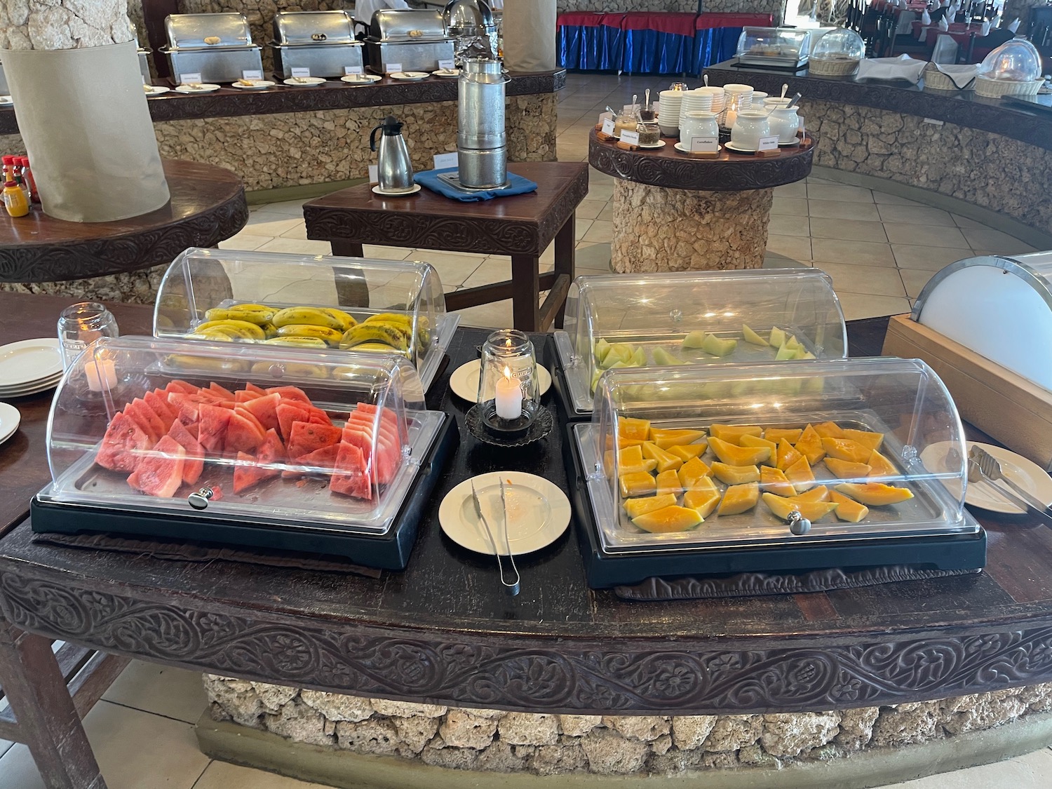 a buffet table with food in containers