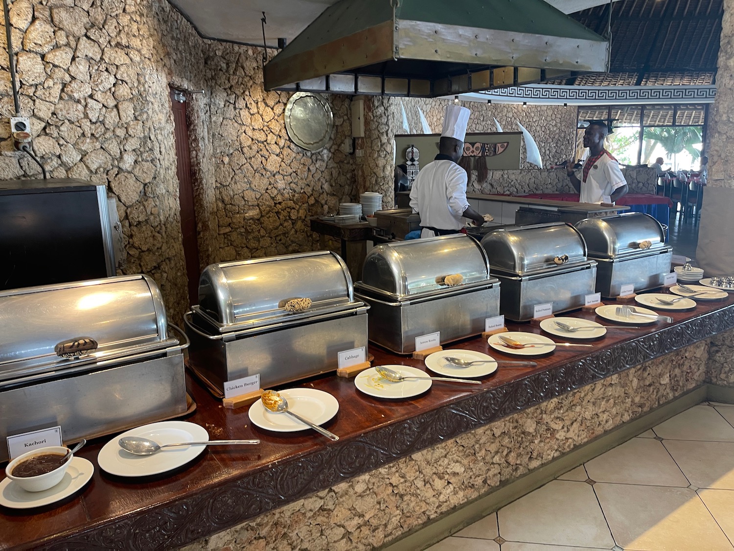 a buffet line of food on a counter