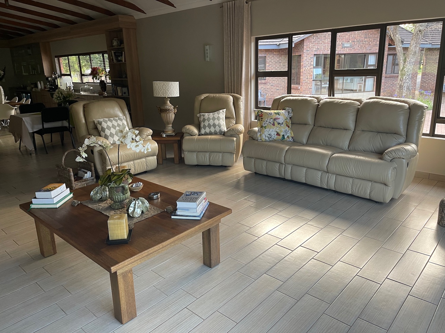 a living room with a couch and chairs