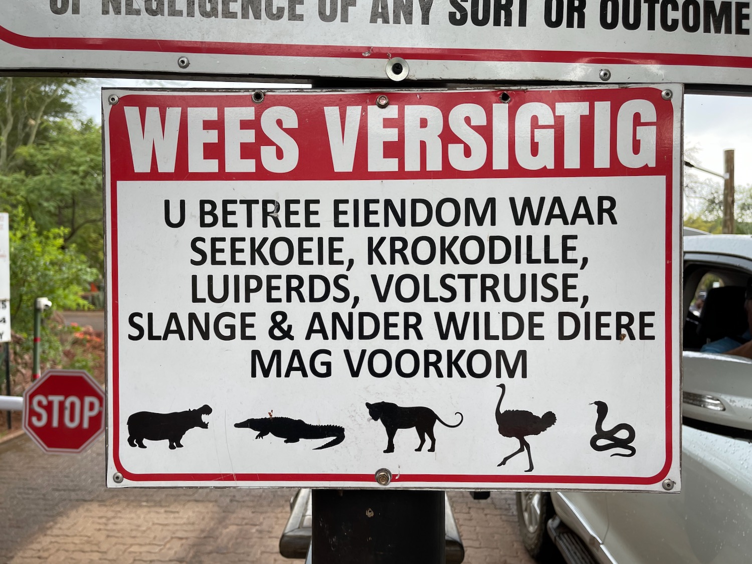 a sign with animals and birds on it
