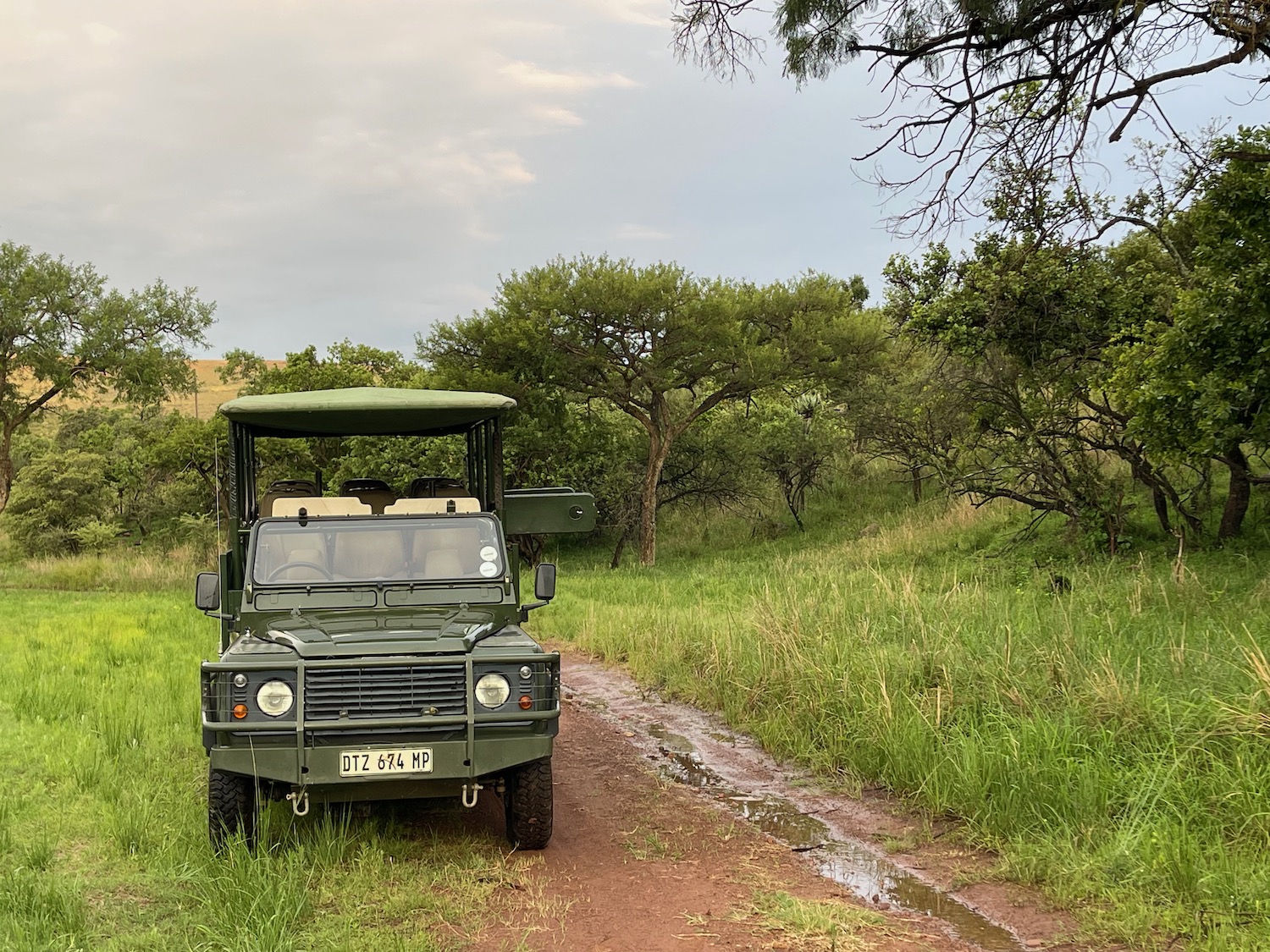 a vehicle parked on a dirt road