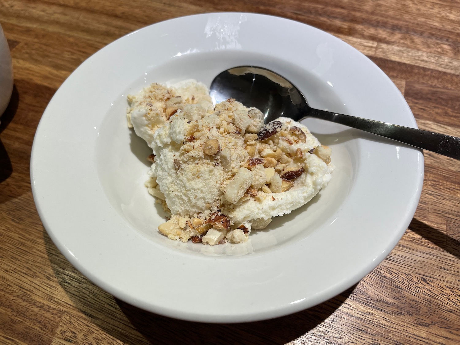 a plate of ice cream with a spoon