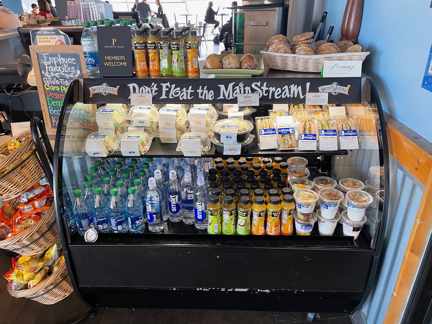 a display case with drinks and beverages