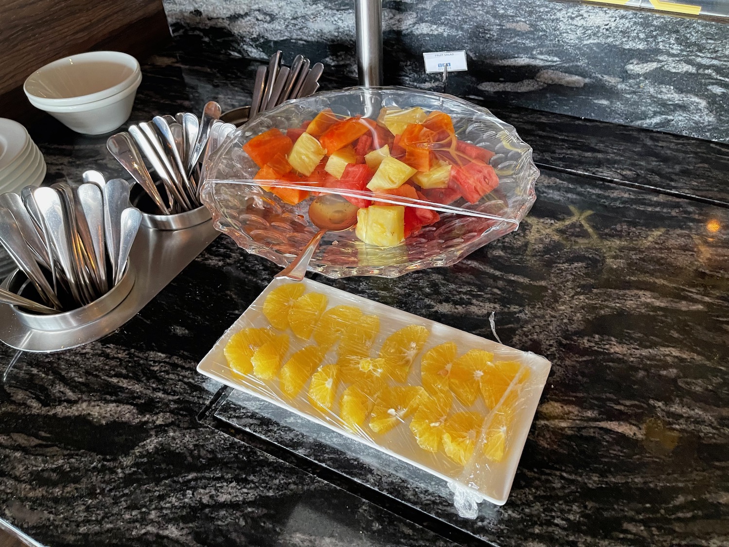 a plate of fruit on a counter