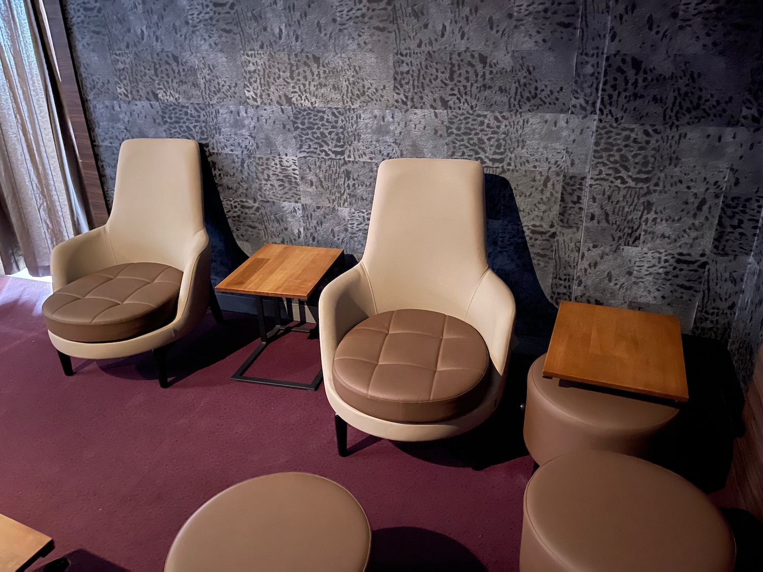 a group of chairs and tables in a room