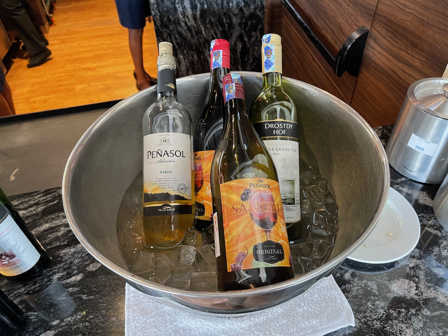 a group of bottles in a bowl of ice