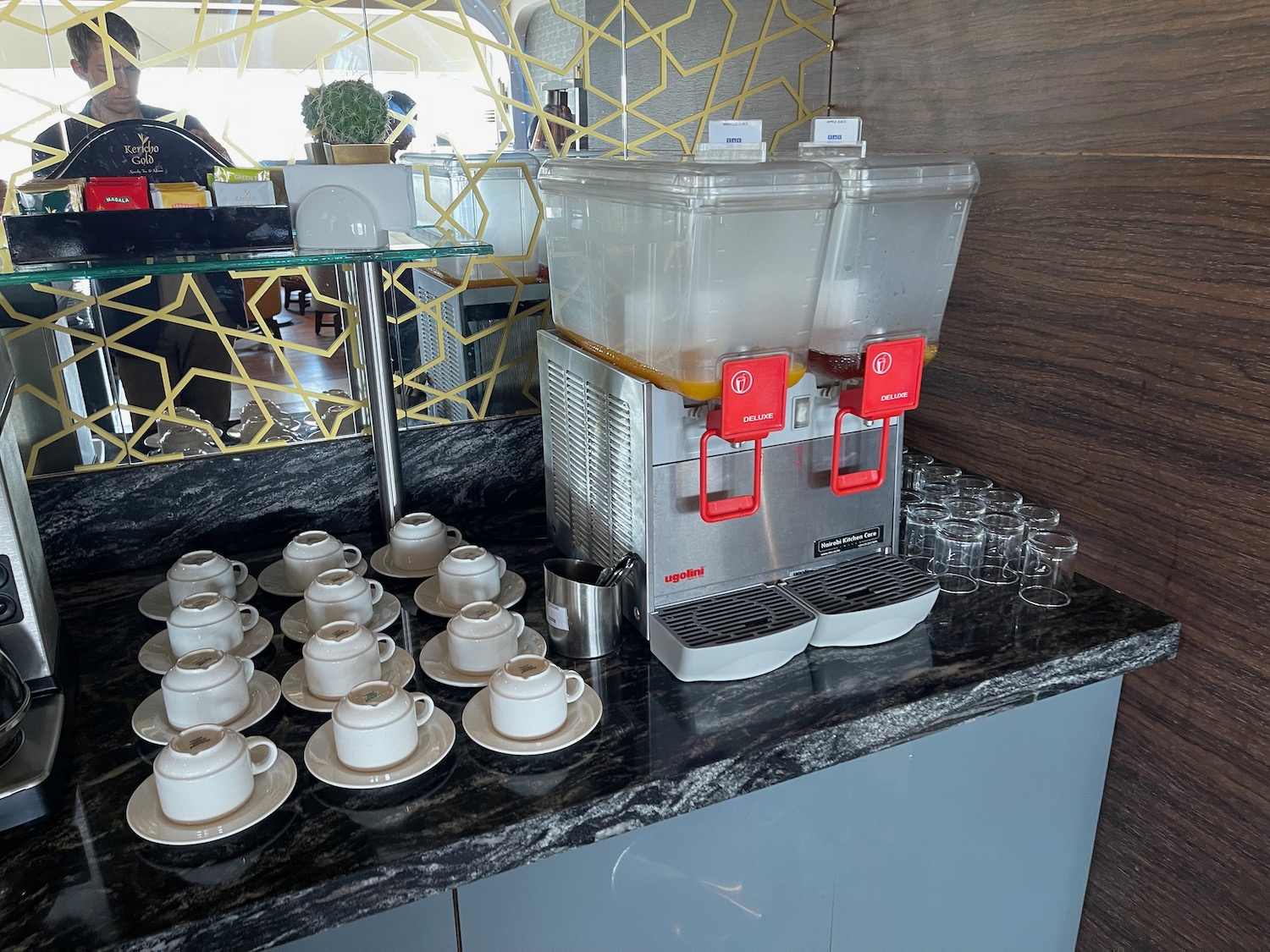 a group of cups and a machine on a counter