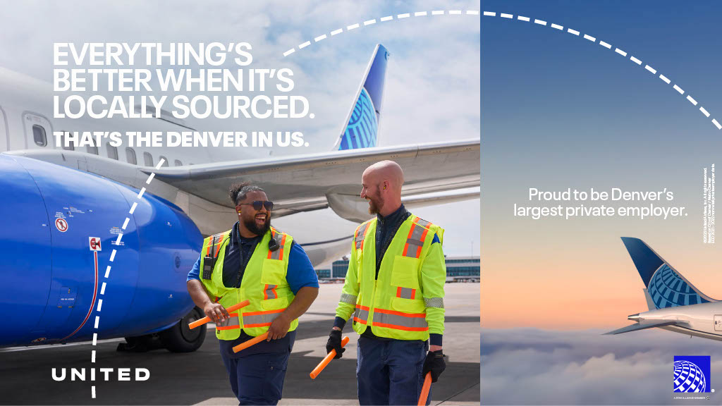 two men wearing safety vests standing next to an airplane