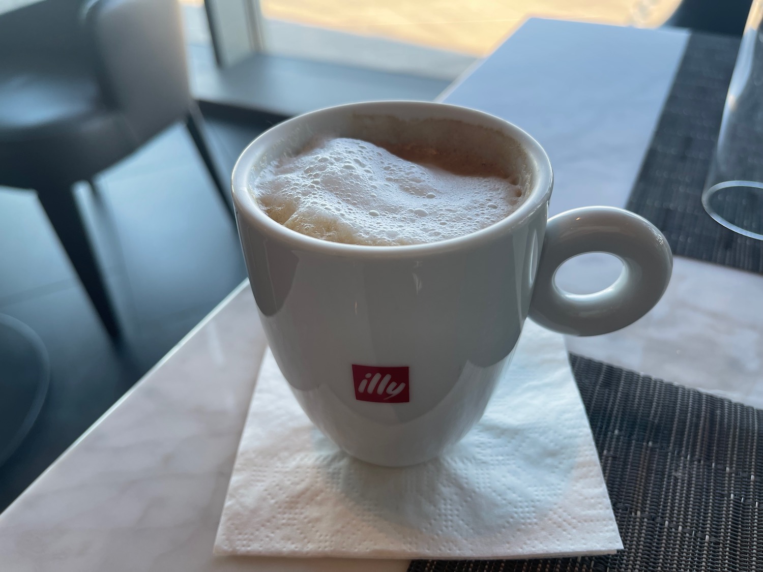 a cup of coffee with foam in it