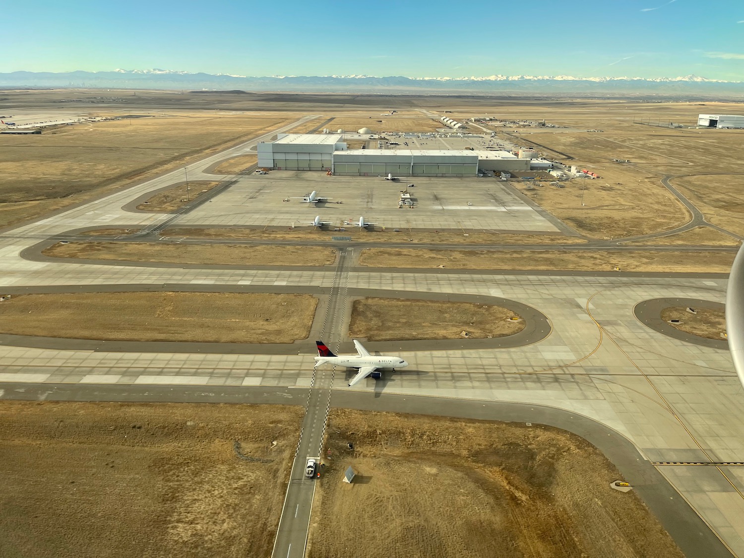an airport with planes on the runway