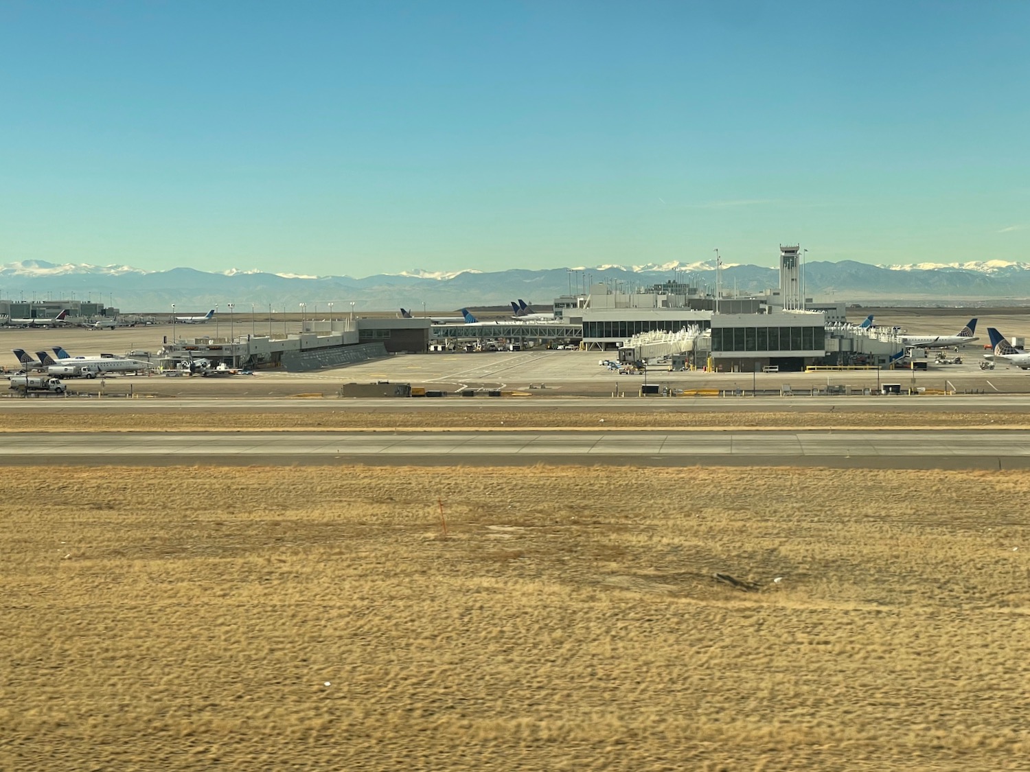 a airport with a runway and buildings