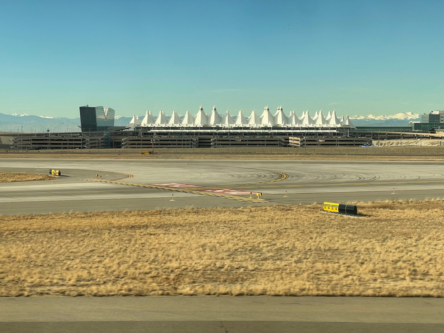 a runway with a large building in the background