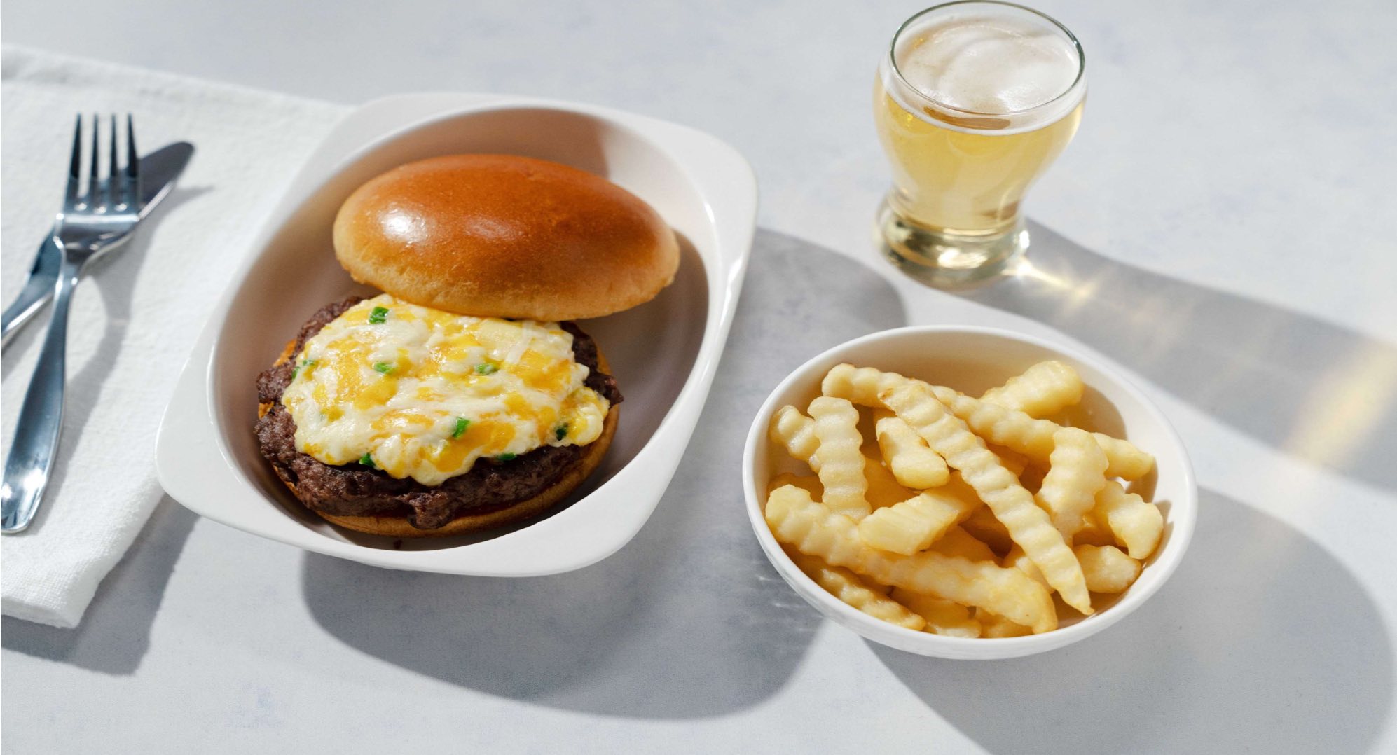 a burger and fries on a plate