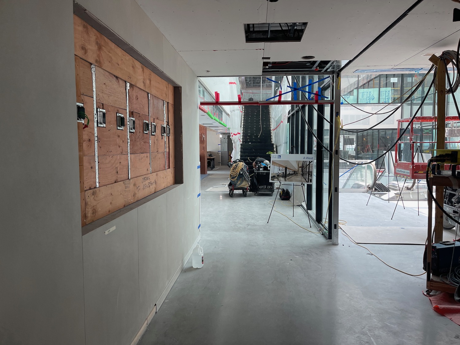 a hallway with a large wooden door and a large wood board