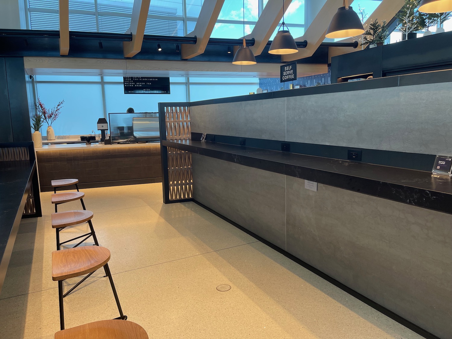 a counter with chairs and a bar