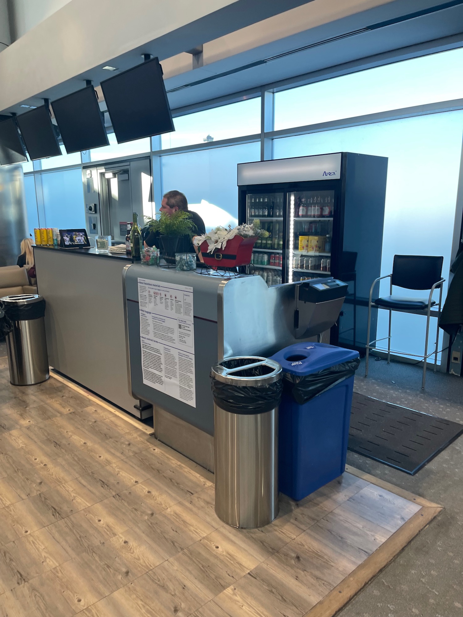 a man standing behind a counter in a building