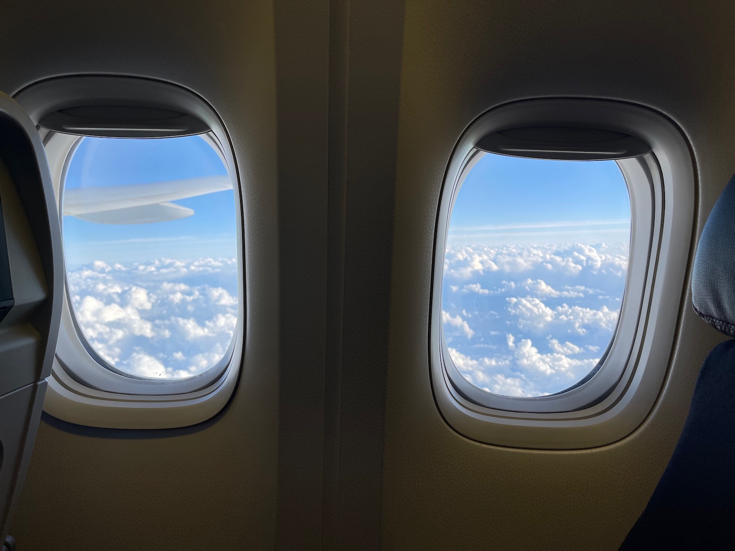 two windows with clouds and blue sky