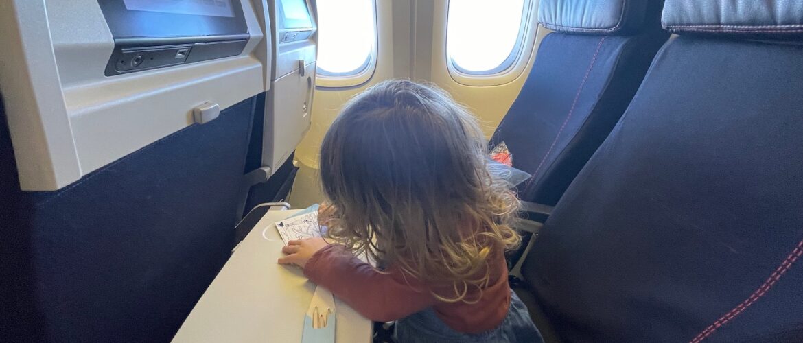 a child sitting on a plane