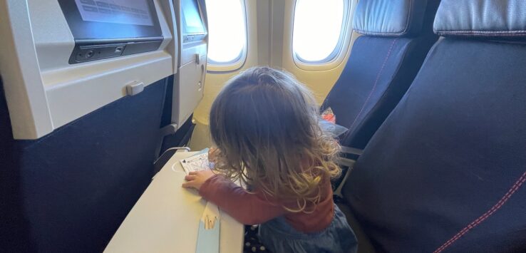 a child sitting on a plane