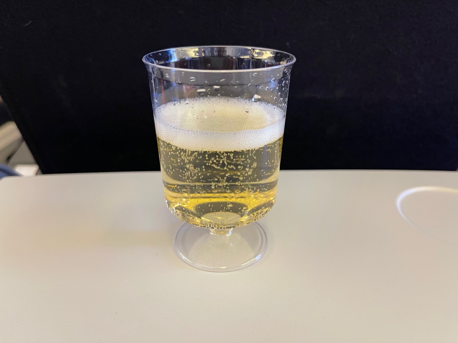 a glass of yellow liquid