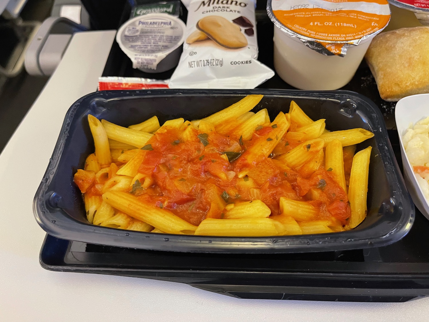 a tray of pasta and sauce