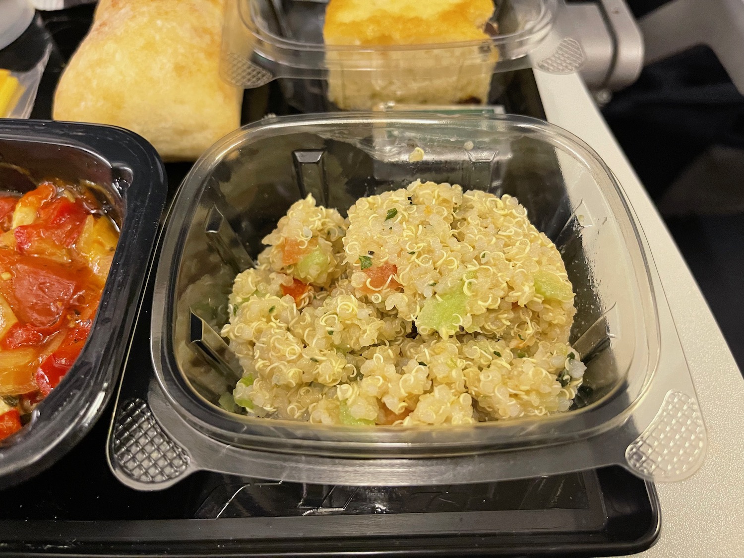 a bowl of quinoa and vegetables in a tray