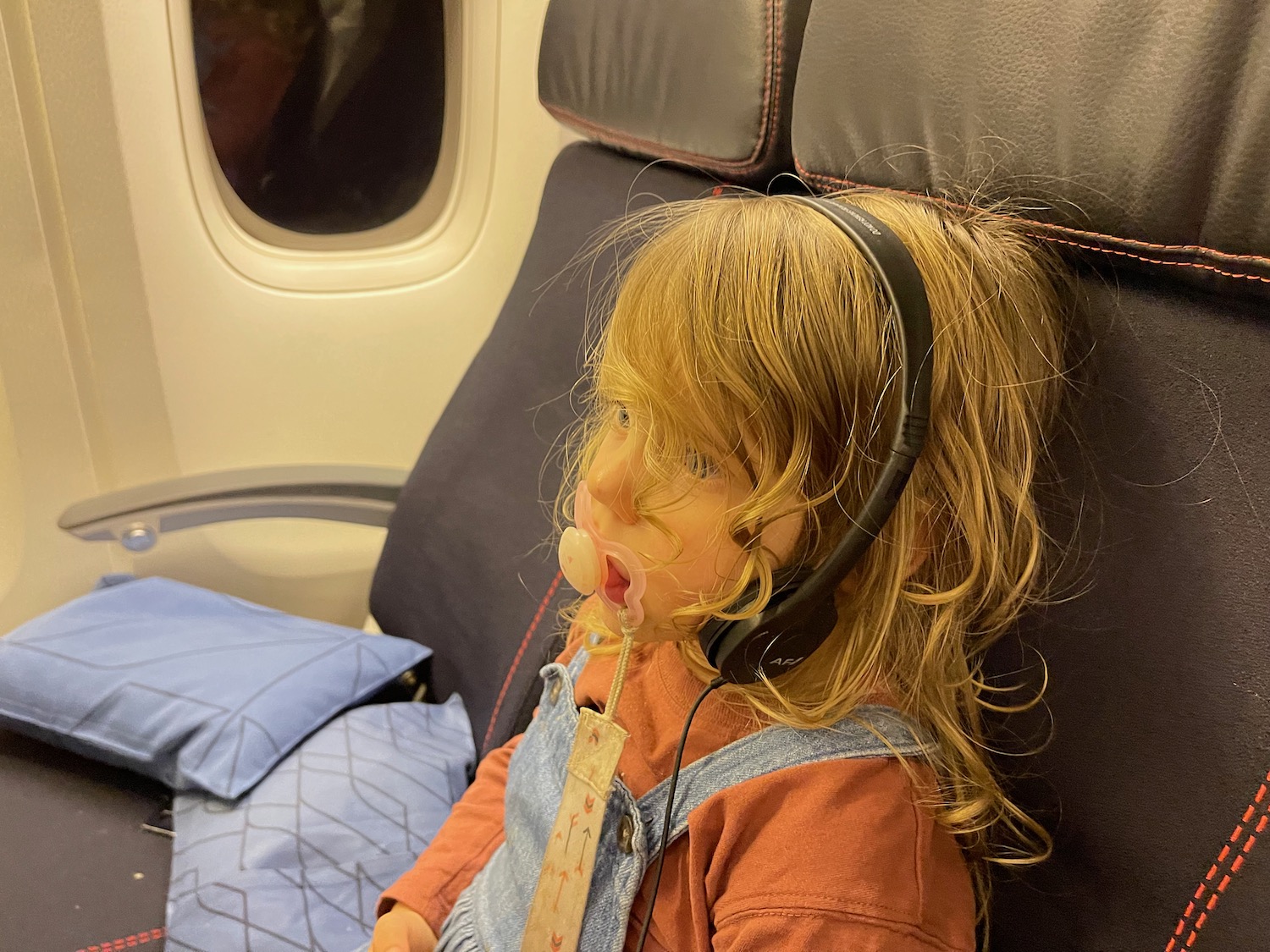 a child doll with headphones on