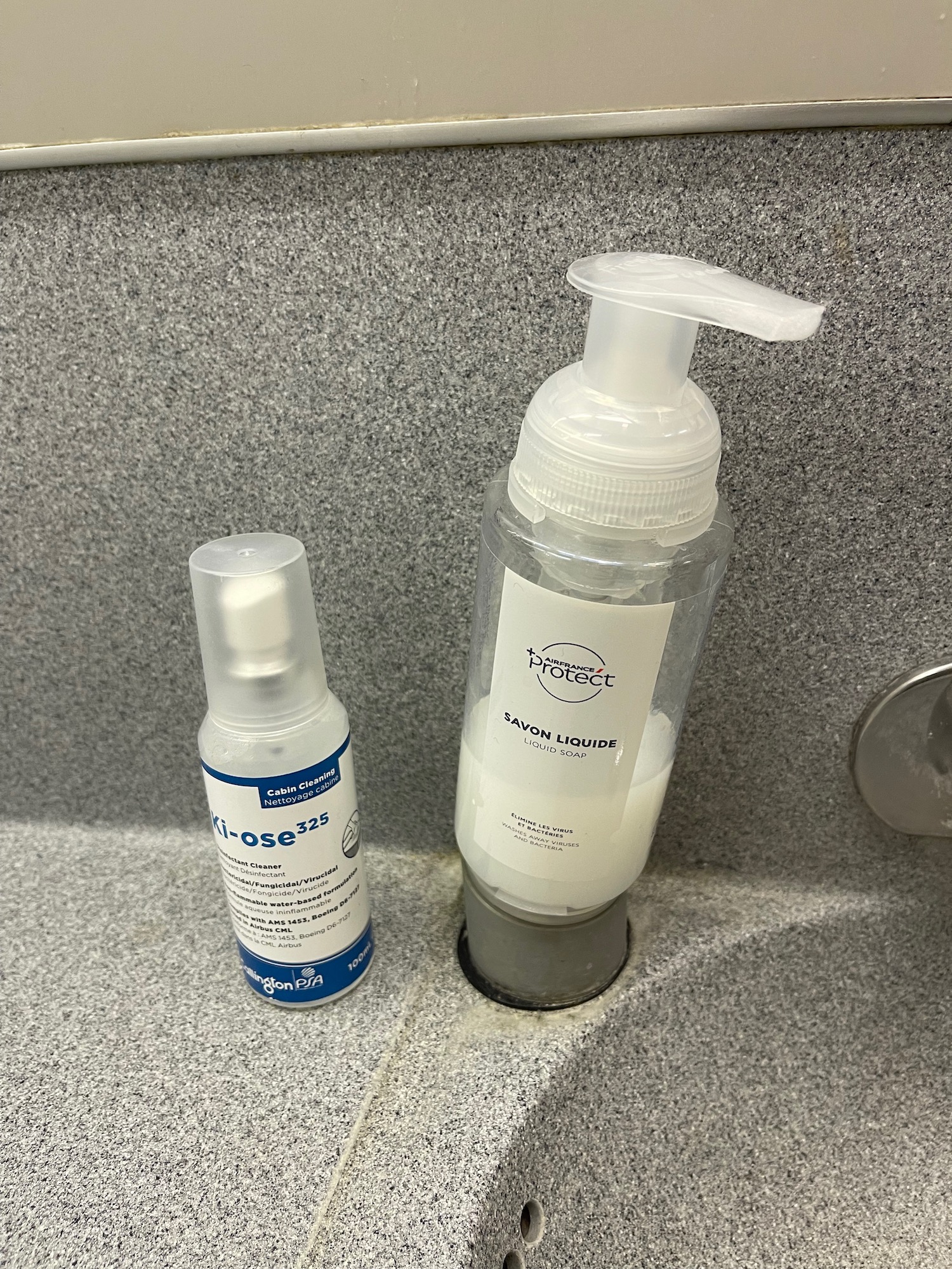 a bottle of liquid next to a bottle of liquid