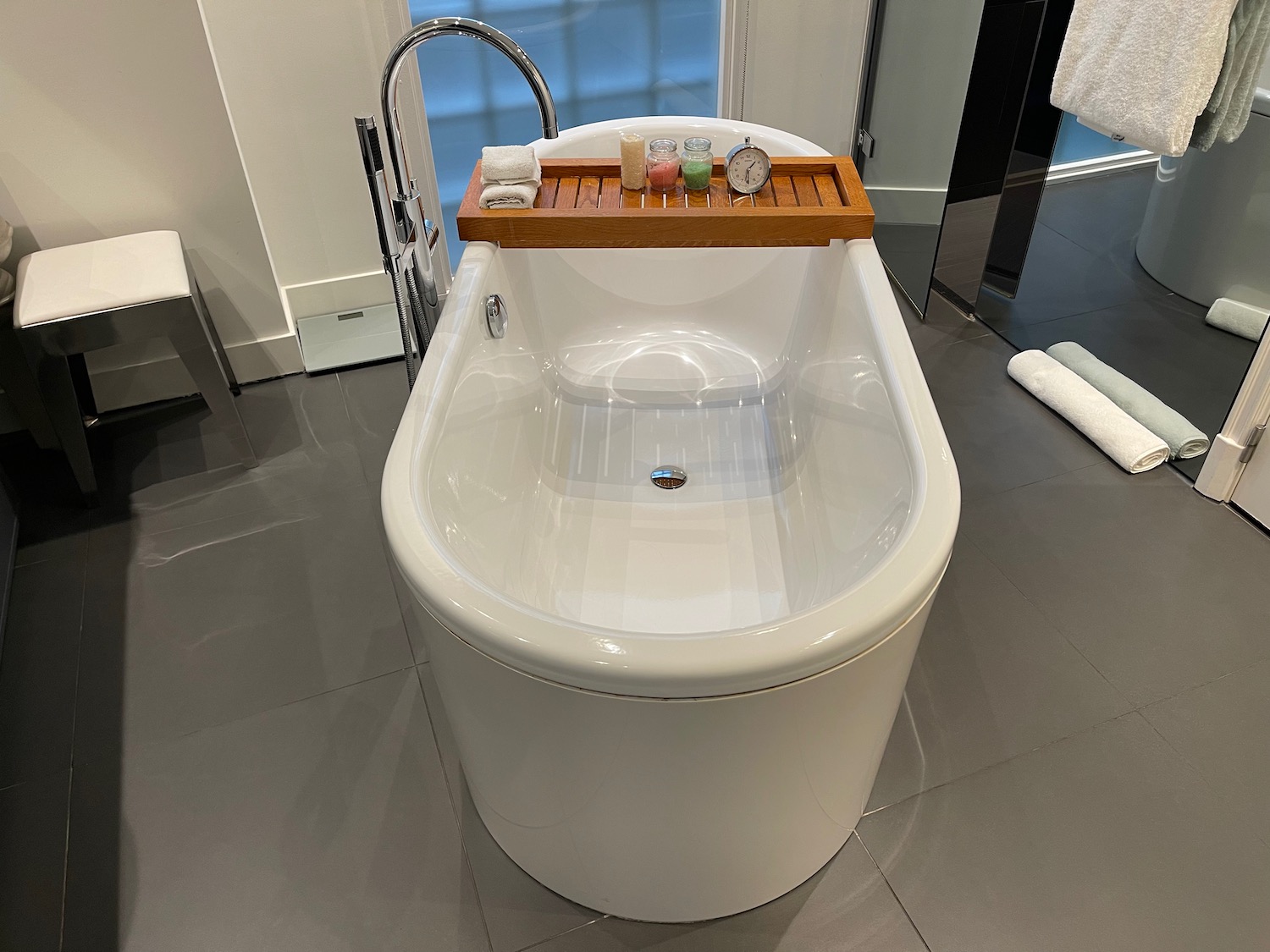 a bathtub with a tray on it