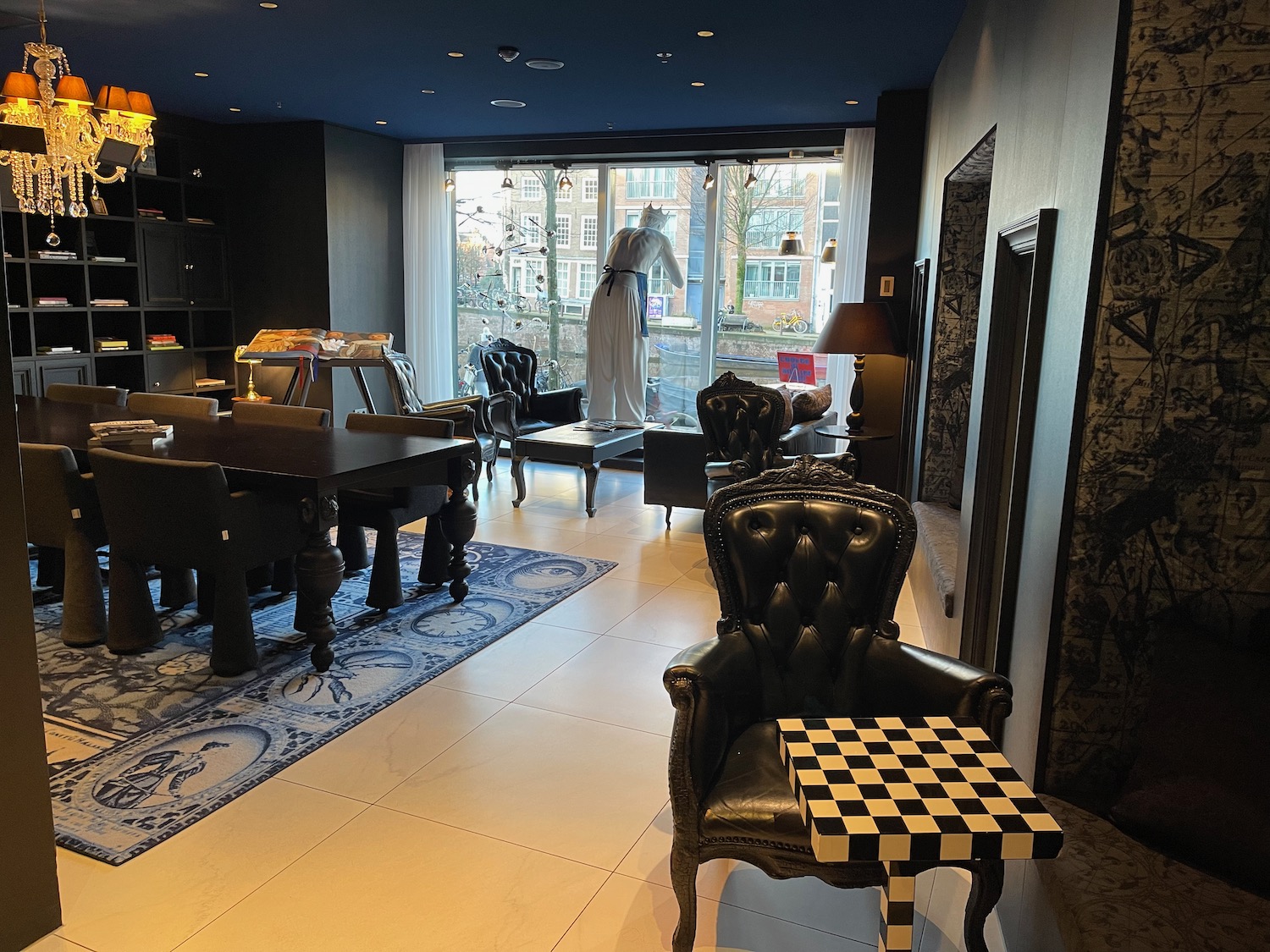 a room with a checkered table and chairs