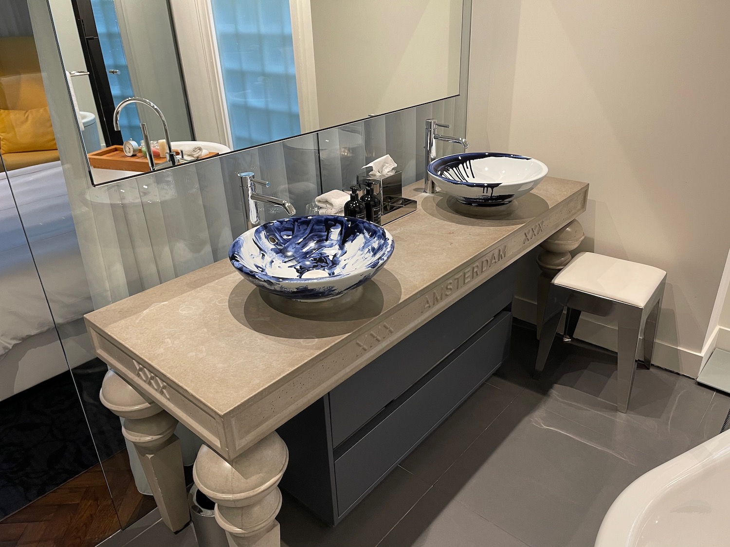 a bathroom with a sink and mirror